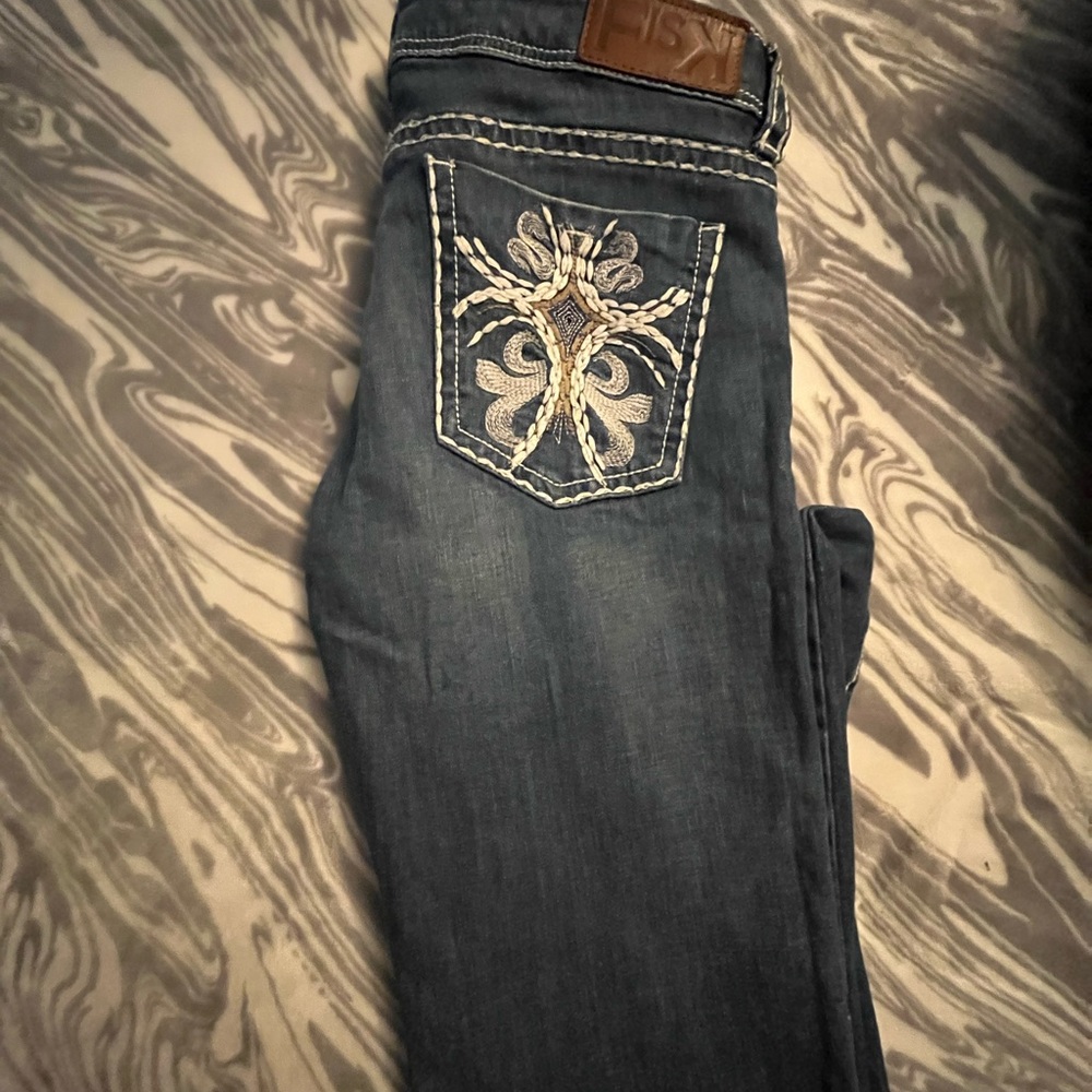 Fish k jeans , with cross drawings